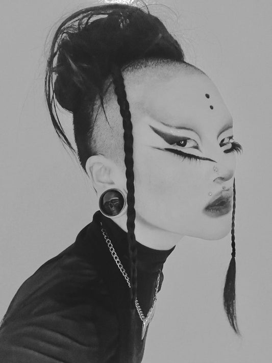 Black and white side profile of a model wearing a Dark gaze double flared ear plug