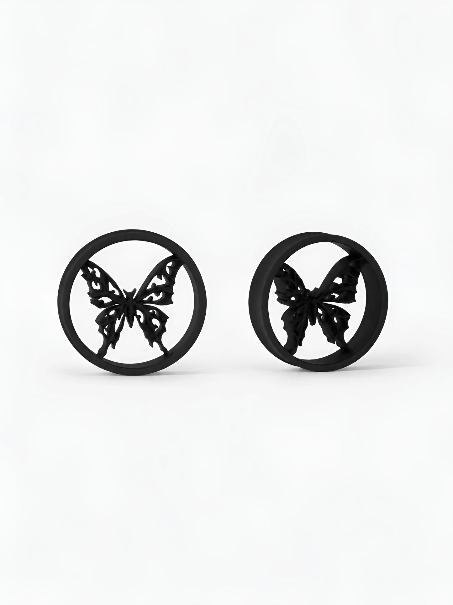 Pair of black Butterfly double flared ear tunnels on a white background
