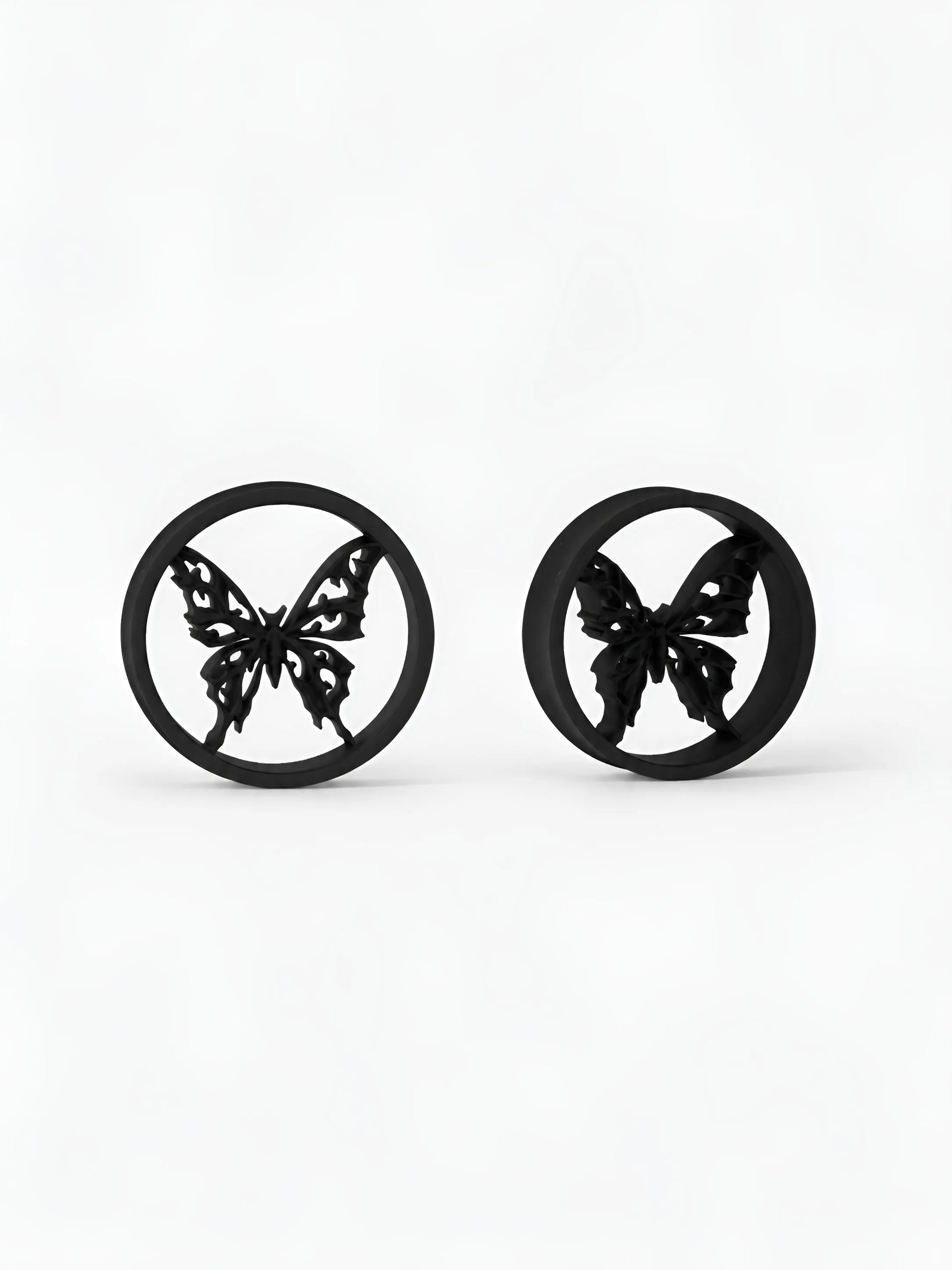 Pair of black Butterfly double flared ear tunnels on a white background