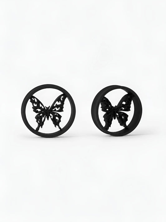 Pair of black Butterfly double flared ear tunnels on a white background