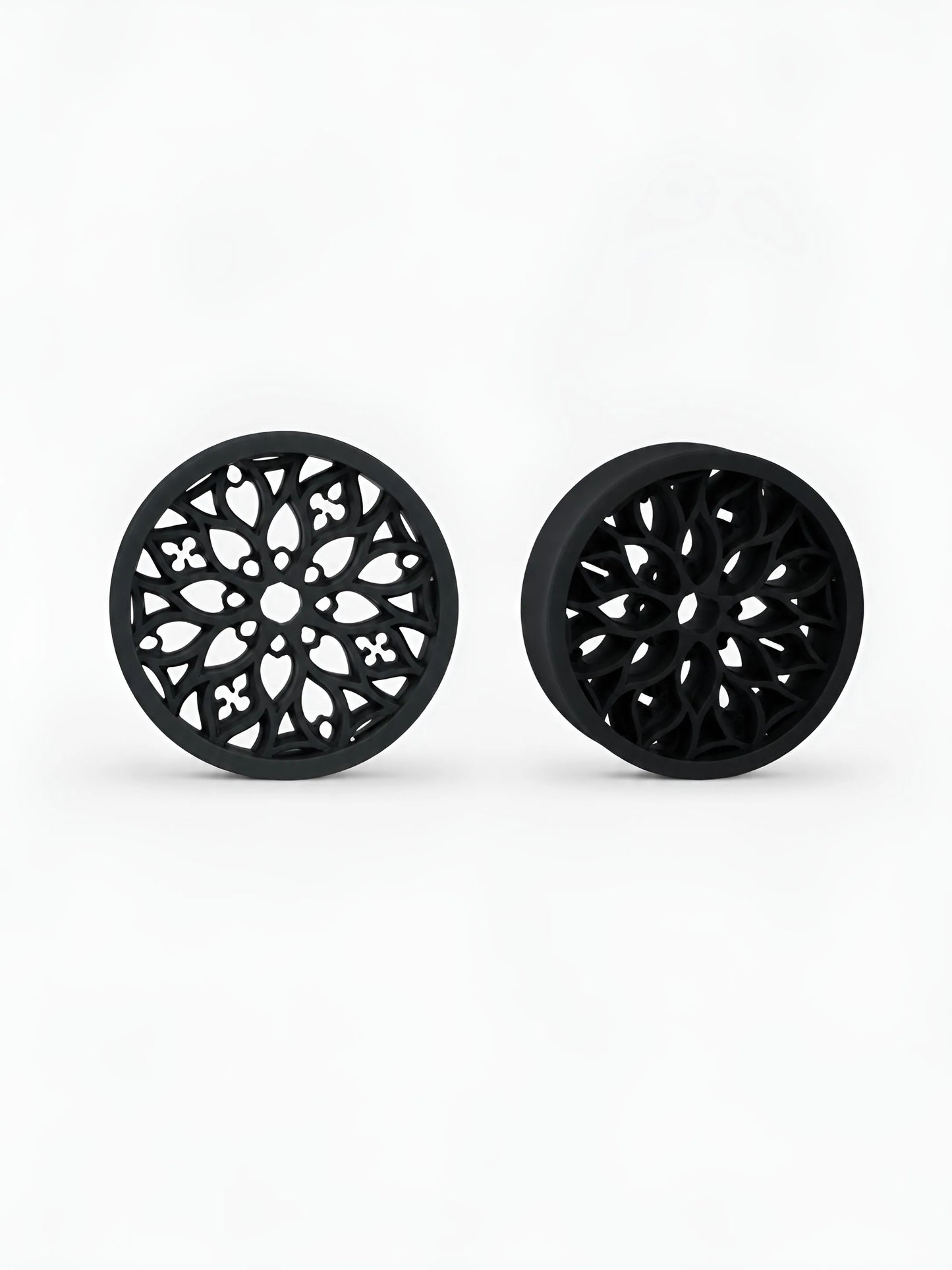 Pair of black Tracery double flared ear tunnels on a white background