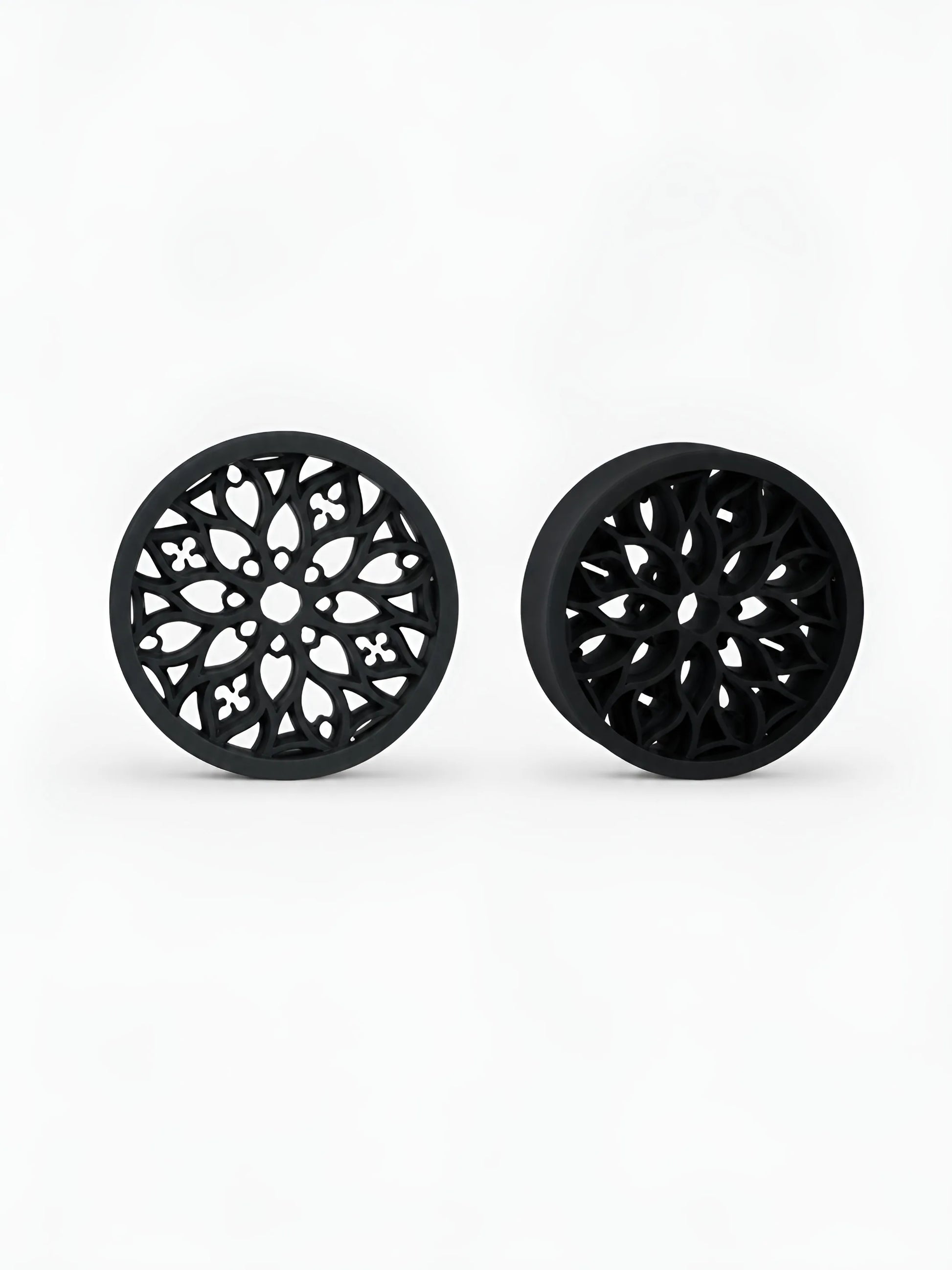 Pair of black Tracery double flared ear tunnels on a white background