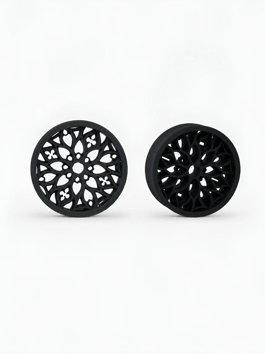 Pair of black Tracery double flared ear tunnels on a white background