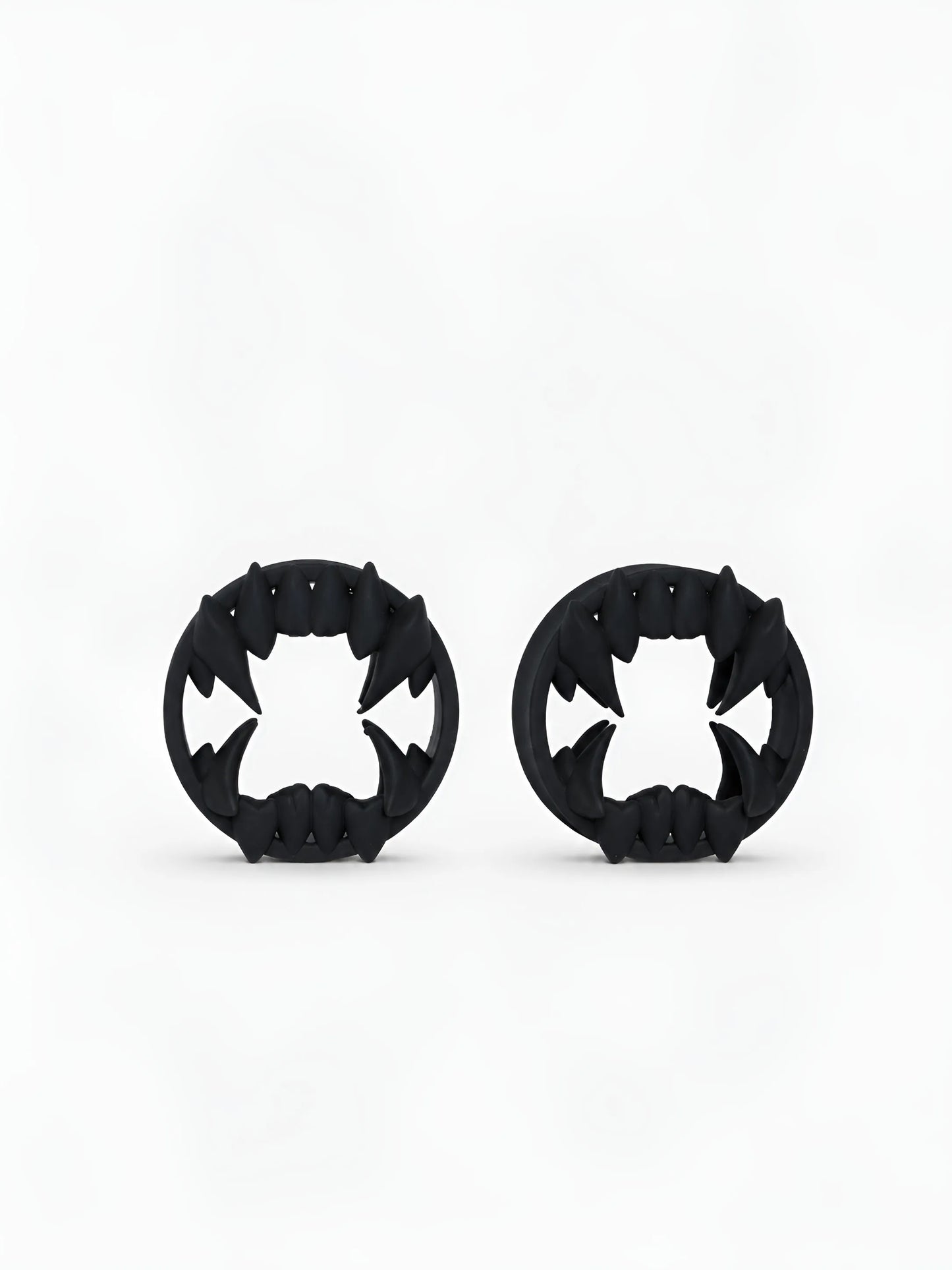 Pair of black Beast double flared ear tunnels on a white background