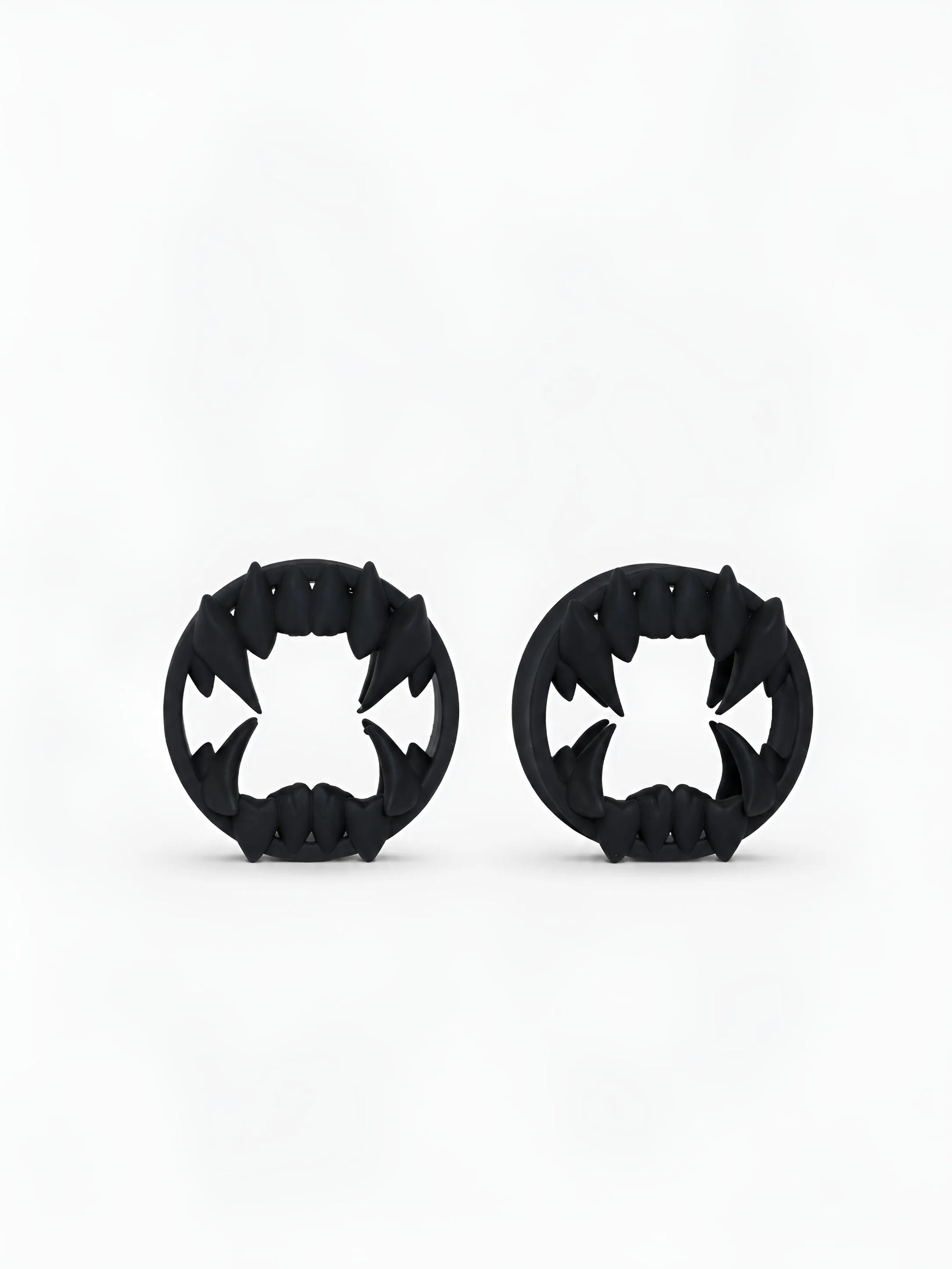 Pair of black Beast double flared ear tunnels on a white background