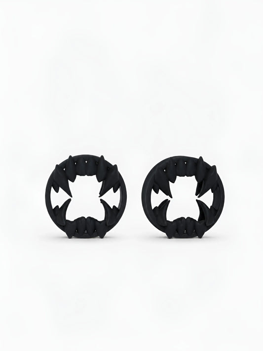 Pair of black Beast double flared ear tunnels on a white background