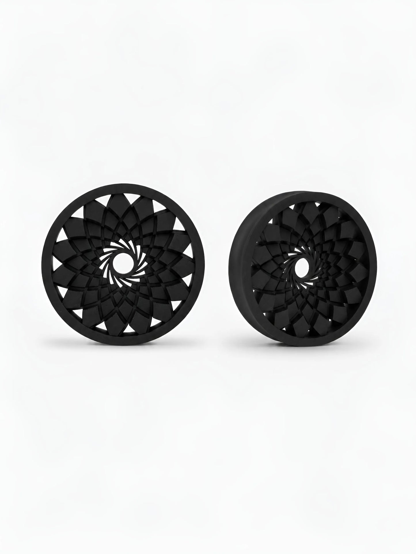 Pair of black Mandala double flared ear tunnels on a white background