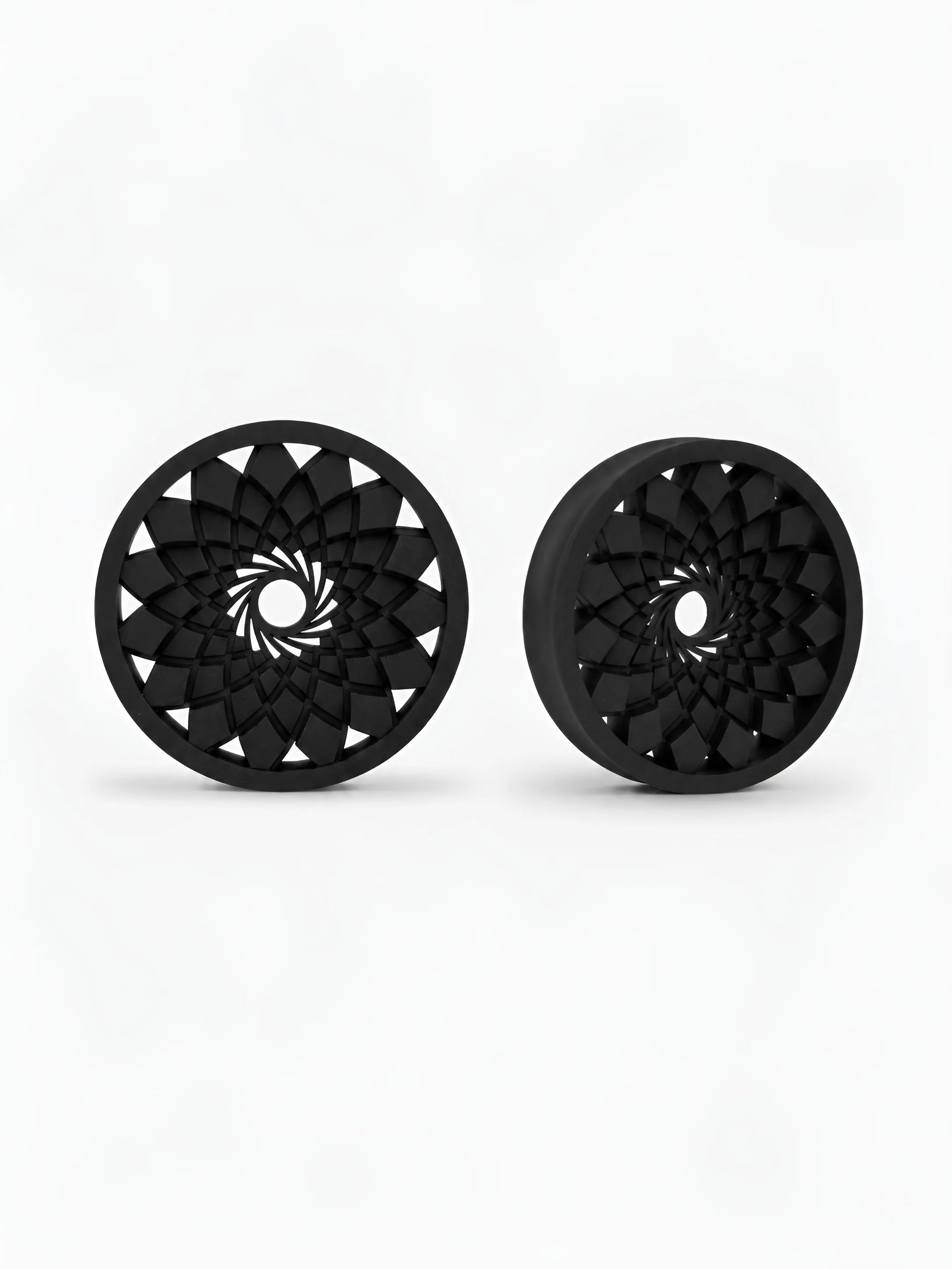 Pair of black Mandala double flared ear tunnels on a white background