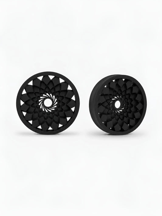 Pair of black Mandala double flared ear tunnels on a white background