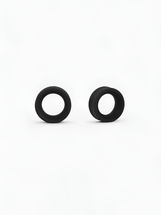 Pair of black Ring double flared ear tunnels on a white background