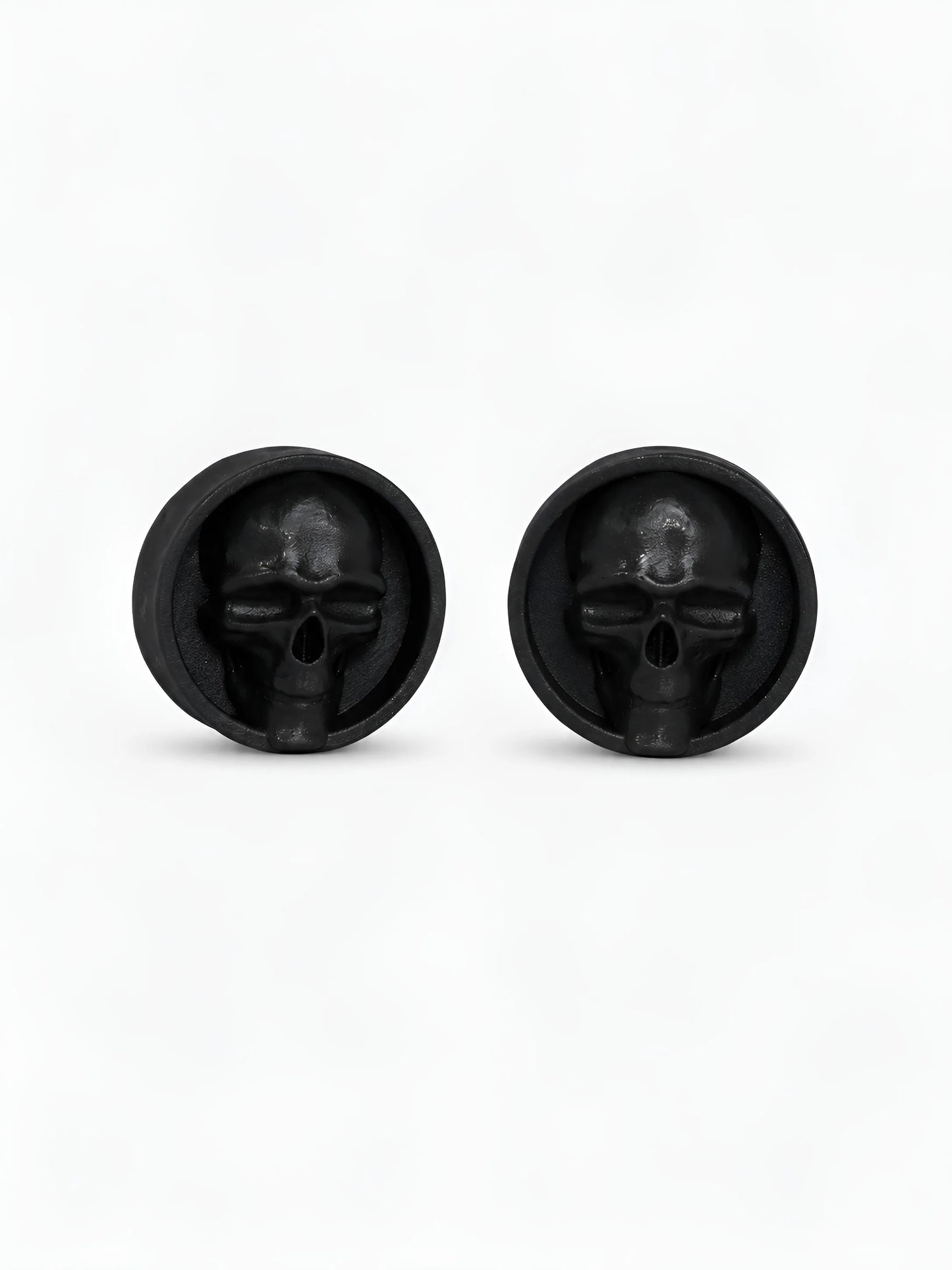 Pair of black Dark gaze double flared ear plugs on a white background