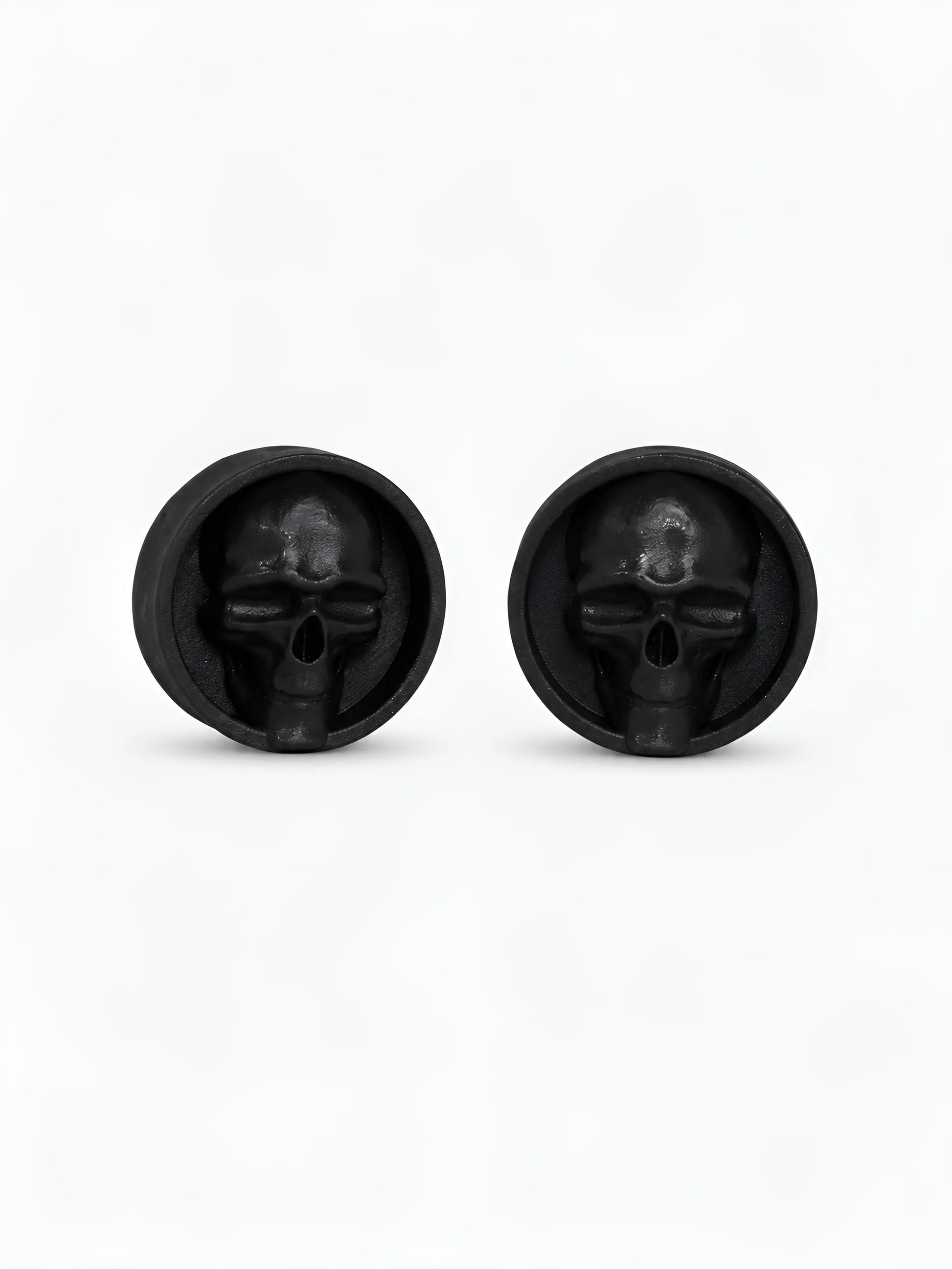 Pair of black Dark gaze double flared ear plugs on a white background