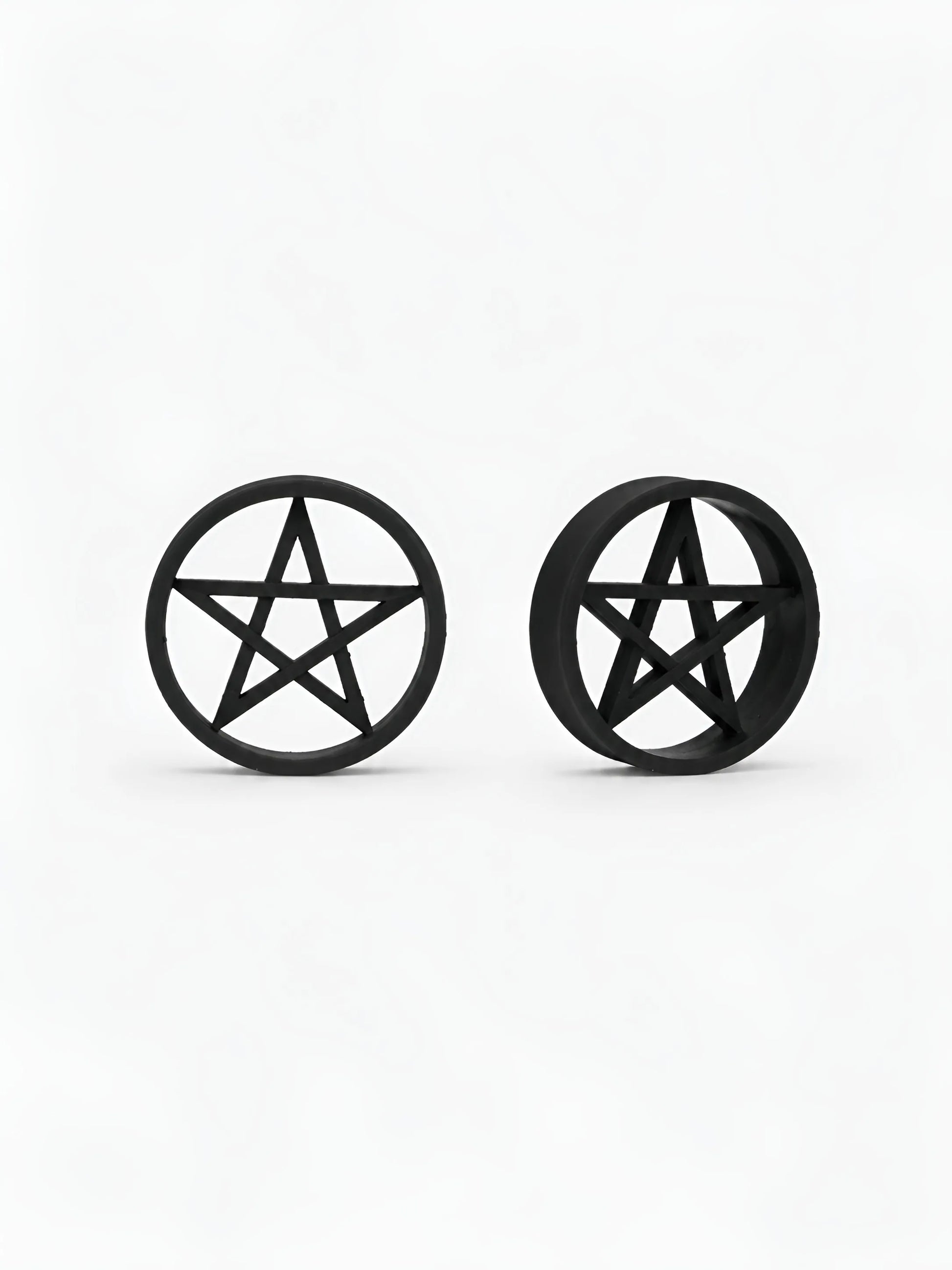 Pair of black Pentacle double flared ear tunnels on a white background