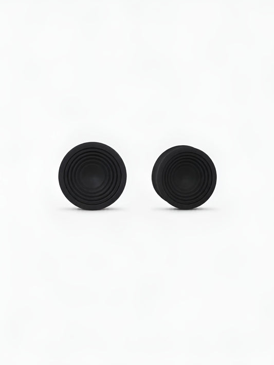 Pair of translucent Ripple double flared ear plugs on a white background