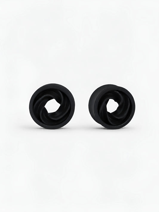 Pair of black Intertwine double flared ear tunnels on a white background