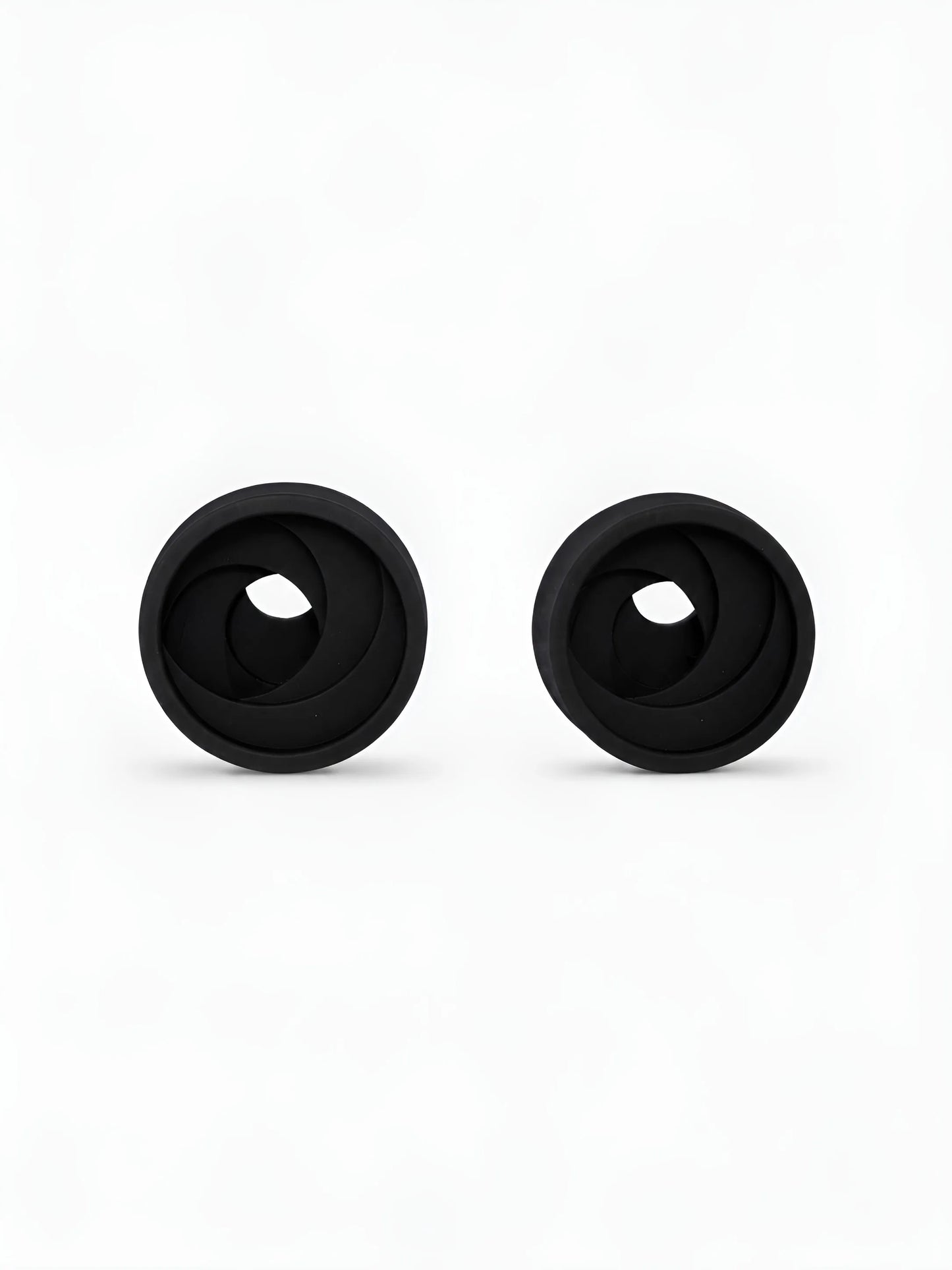 Pair of black Swirl double flared ear tunnels on a white background