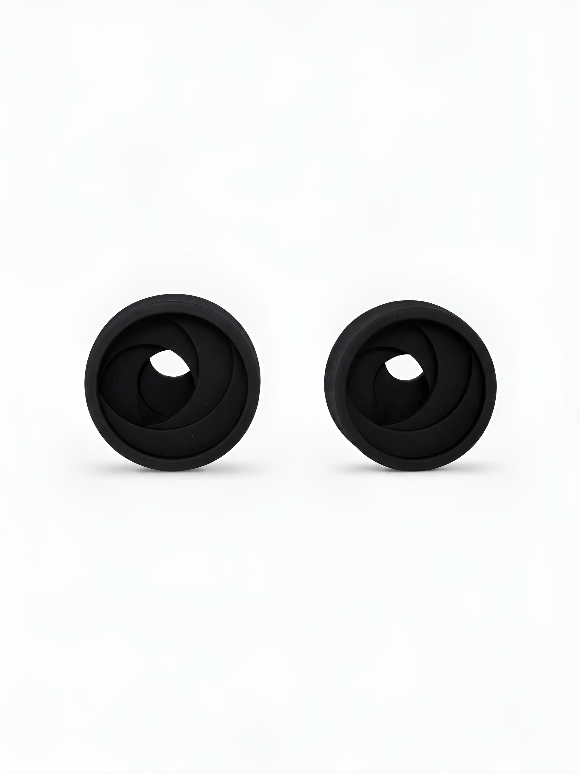 Pair of black Swirl double flared ear tunnels on a white background