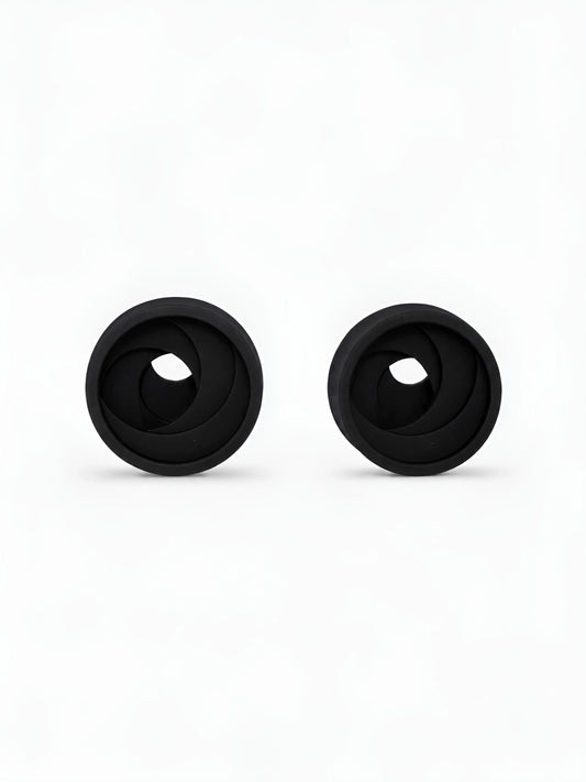 Pair of black Swirl double flared ear tunnels on a white background